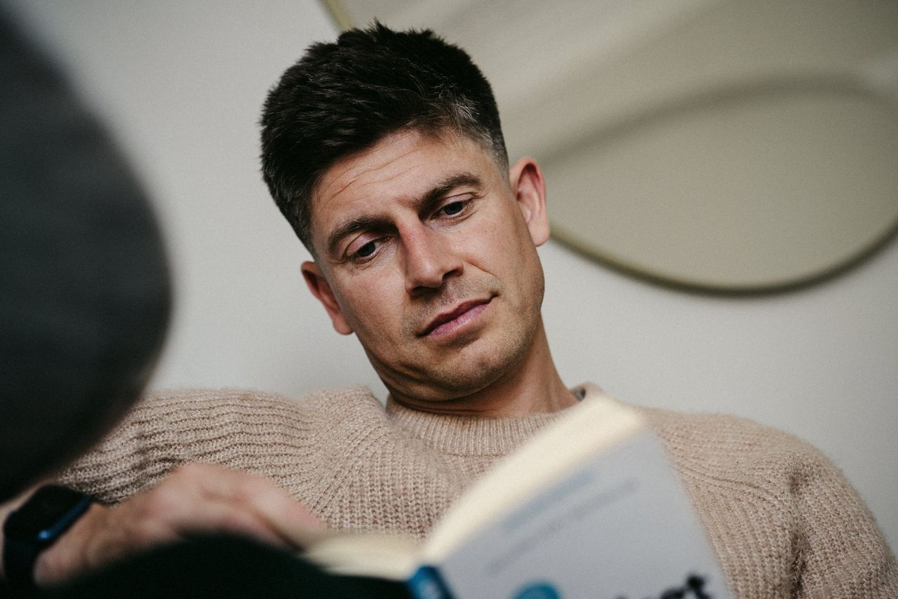 Siôn reading, deep in thought